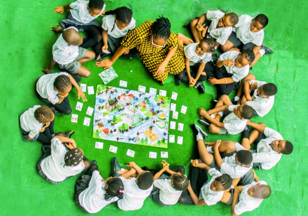 Children playing and smiling at Tiny Patters Academy nursery